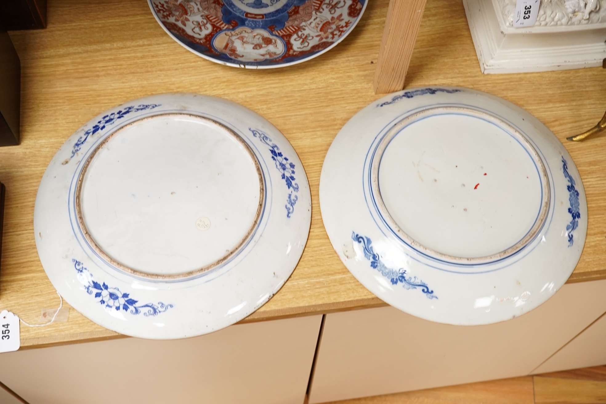 Three large Japanese dishes or chargers to include an Imari pattern example and one depicting Mount Fuji, largest 40cm in diameter